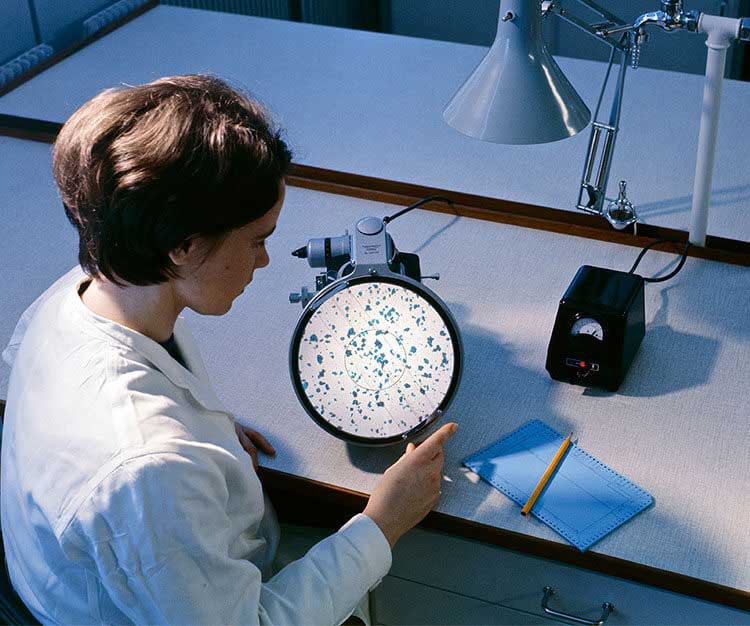 A researcher conducting an experiment in a lab.
